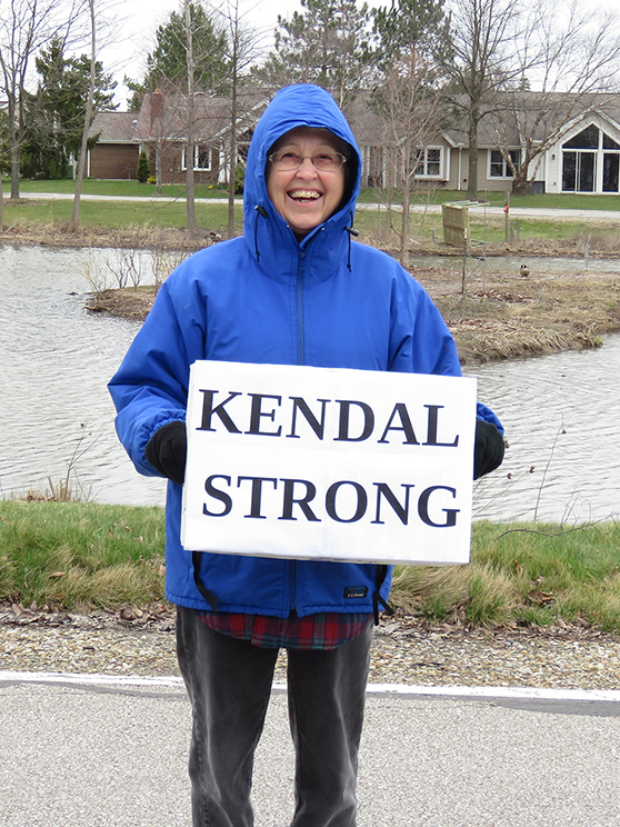 Resident with "Kendal Strong" poster