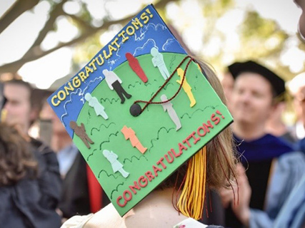 Oberlin College graduate with Congratulations mortar board