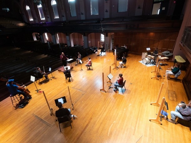 orchestra rehearses on stage