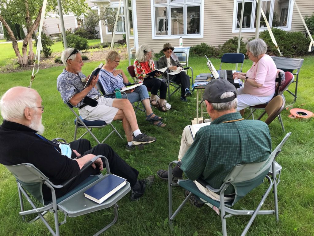 group of people singing hymns