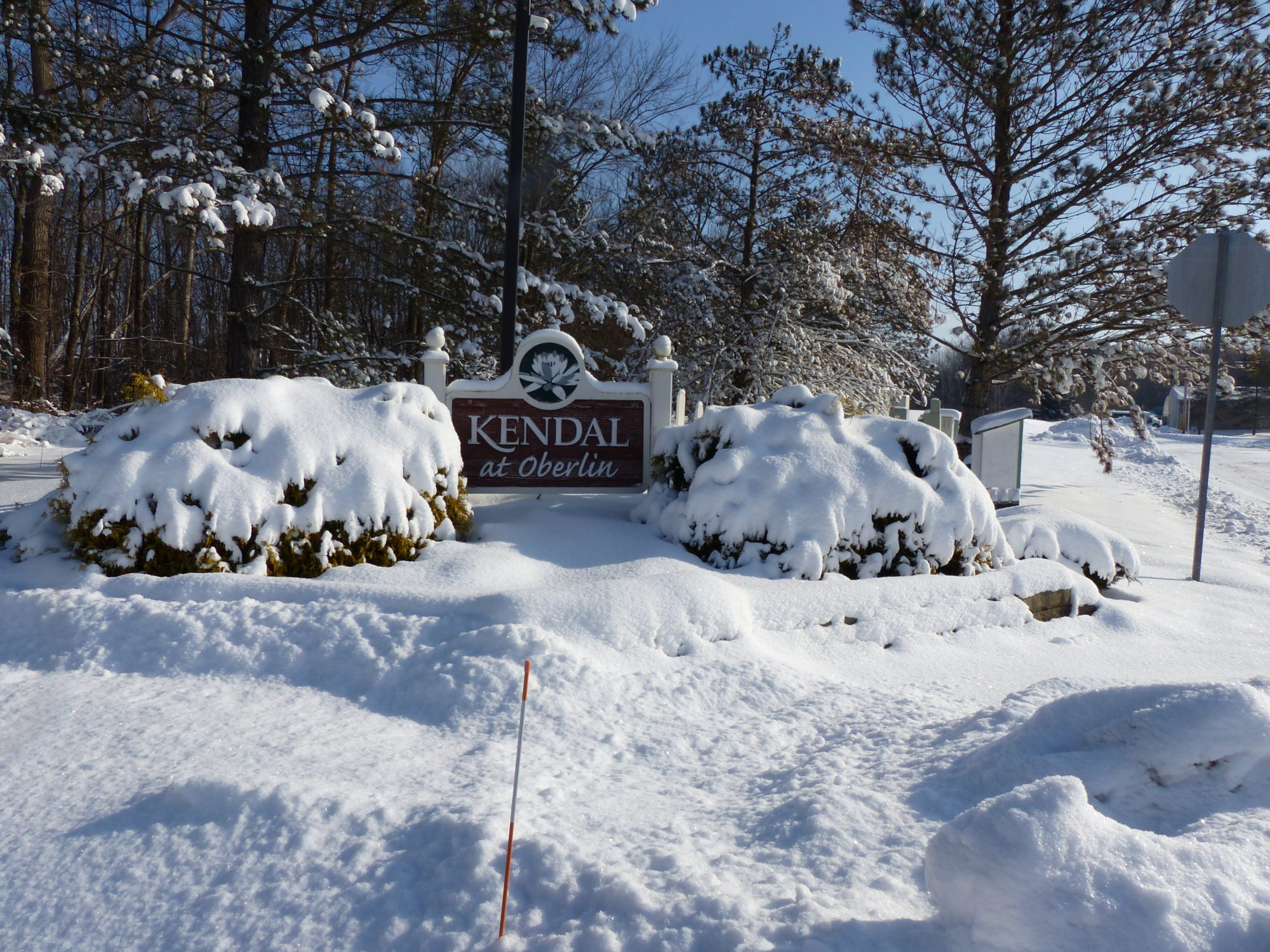 Kendal at Oberlin sign and snow