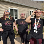 Wellness staff watch the 2024 eclipse