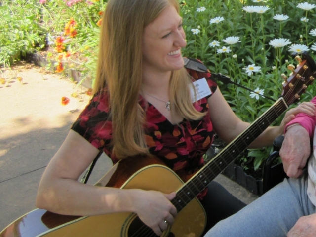 woman playing guitar 
