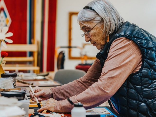 woman working on art 