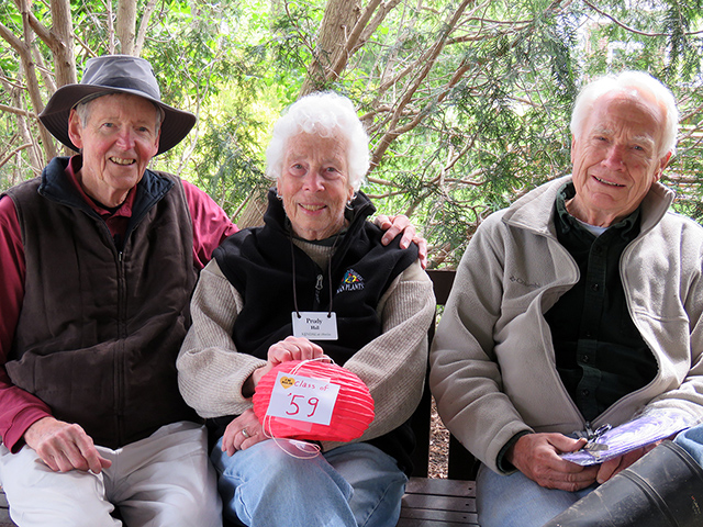 3 OC alumni on a bench