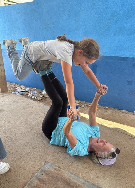 Molly in a yoga pose with her grandniece 