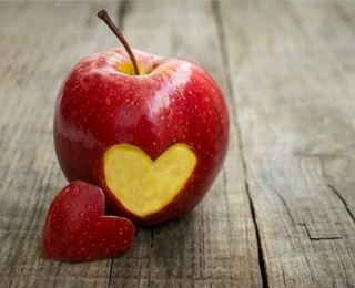 apple with a heart sliced on it