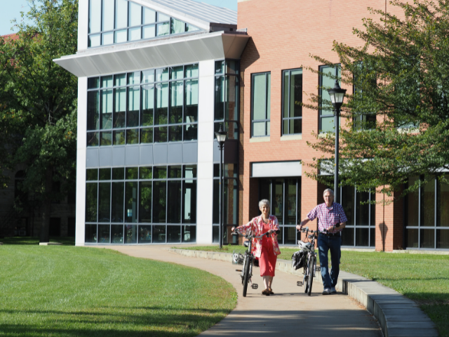 residents on oberlin campus with bikes