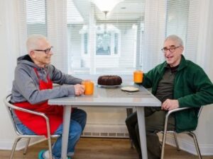 two men sitting at table